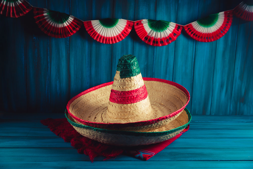 Mexican,Hats,On,A,Serape,With,Festive,Decorations,On,A