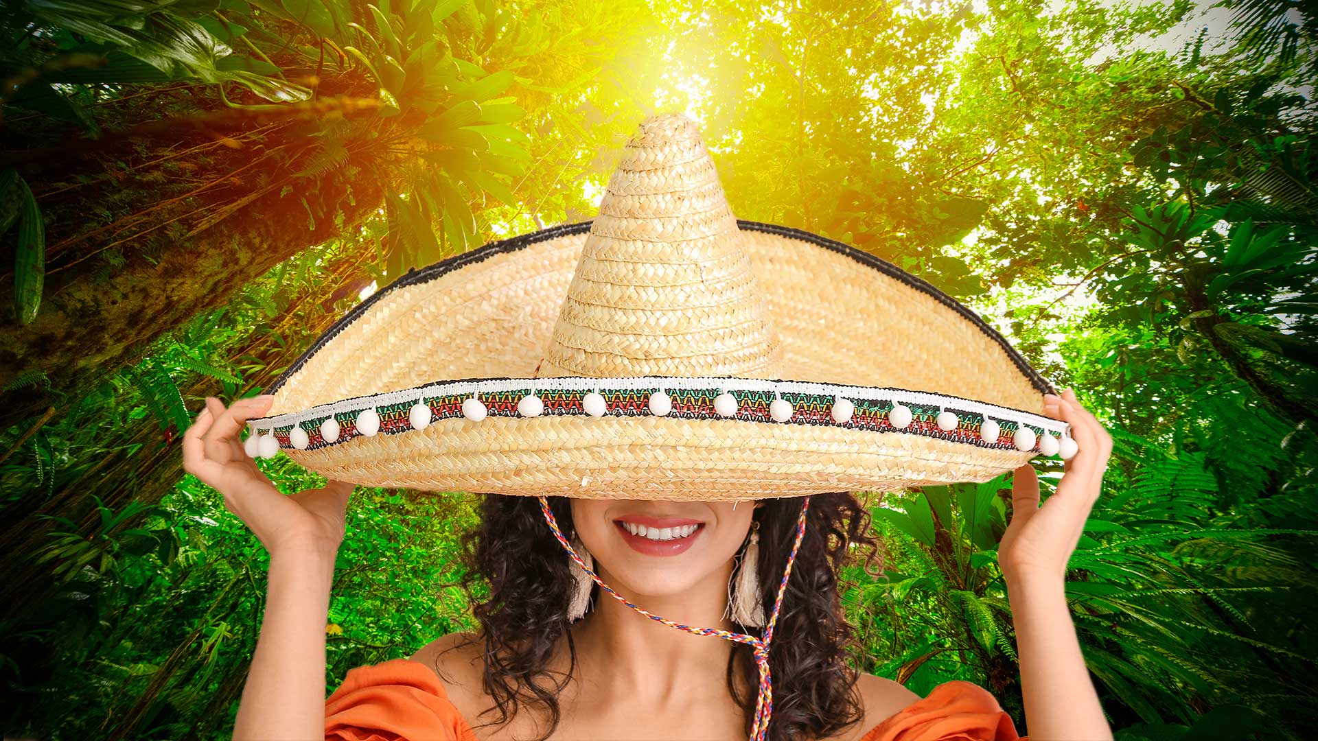 Beautiful woman in sombrero hat on color background